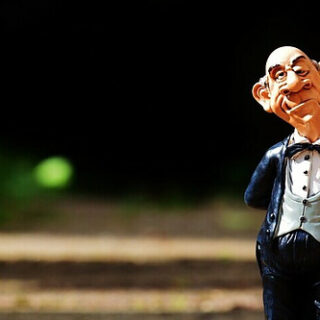 a butler holding champaign