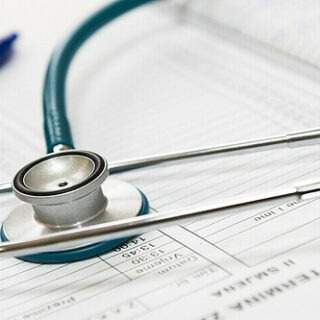 a stethoscope on a health chart