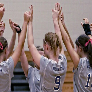 a team of teenage girls playing