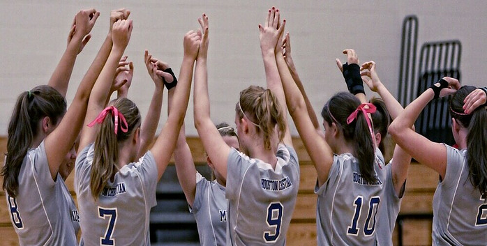 a team of teenage girls playing